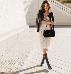 young-stylish-woman-walking-street-fashionable-outfit-holding-purse-wearing-black-leather-jacket-white-lace-dress-spring-autumn-style-posing-high-leather-boots (1)